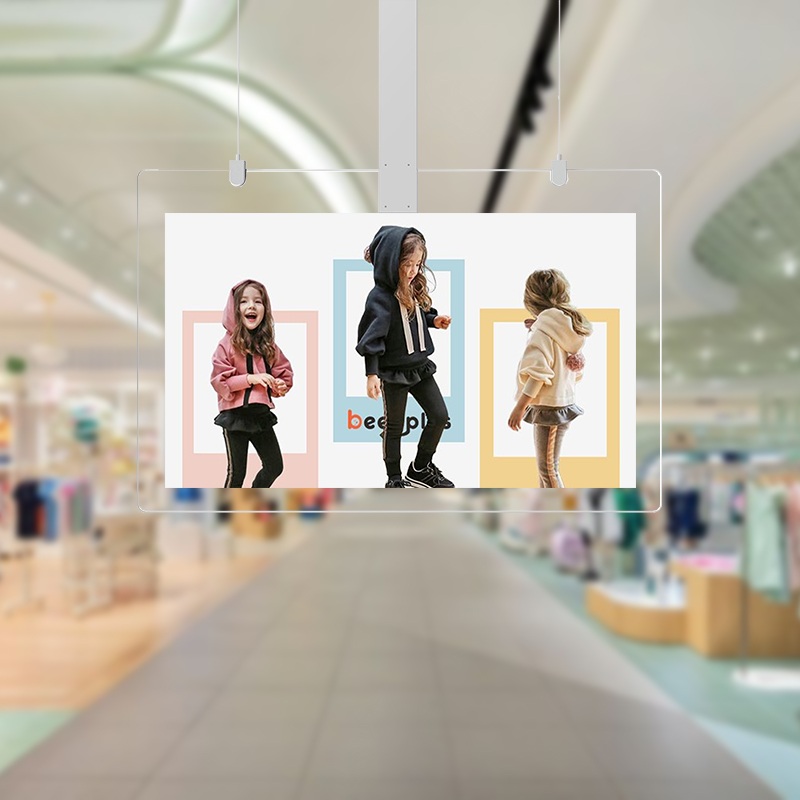 Ceiling-mounted transparent display for commercial advertising in a retail environment