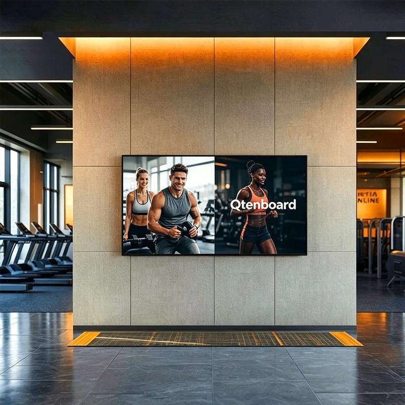 Qtenboard smart digital advertising board integrated into gym accent wall
